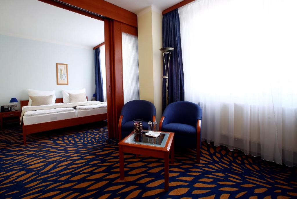 Postel nebo postele na pokoji v ubytování Hotel Central