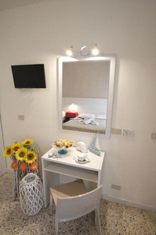 TV a/nebo společenská místnost v ubytování Hotel Tosi