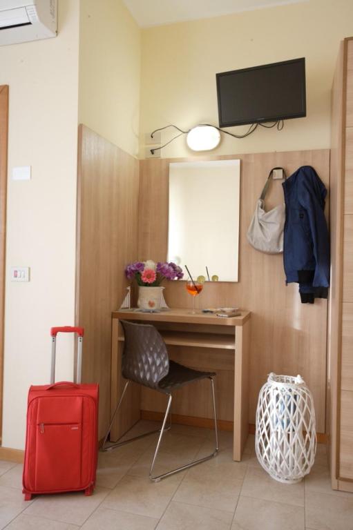 TV a/nebo společenská místnost v ubytování Hotel Tosi