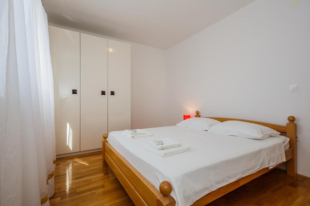 Posteľ alebo postele v izbe v ubytovaní Apartments Selak