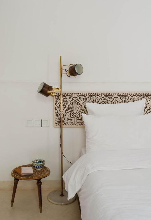 Una cama o camas en una habitación de Numa Marrakech