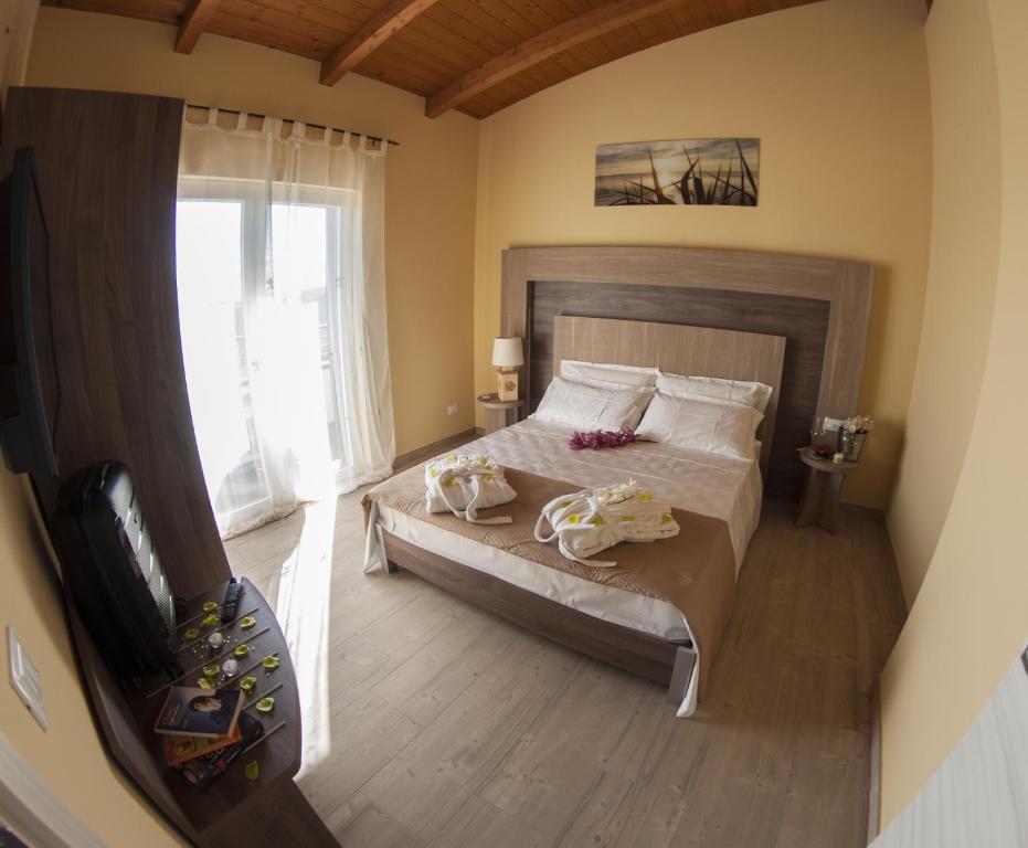 Postel nebo postele na pokoji v ubytování Cataleya Resort & Spa