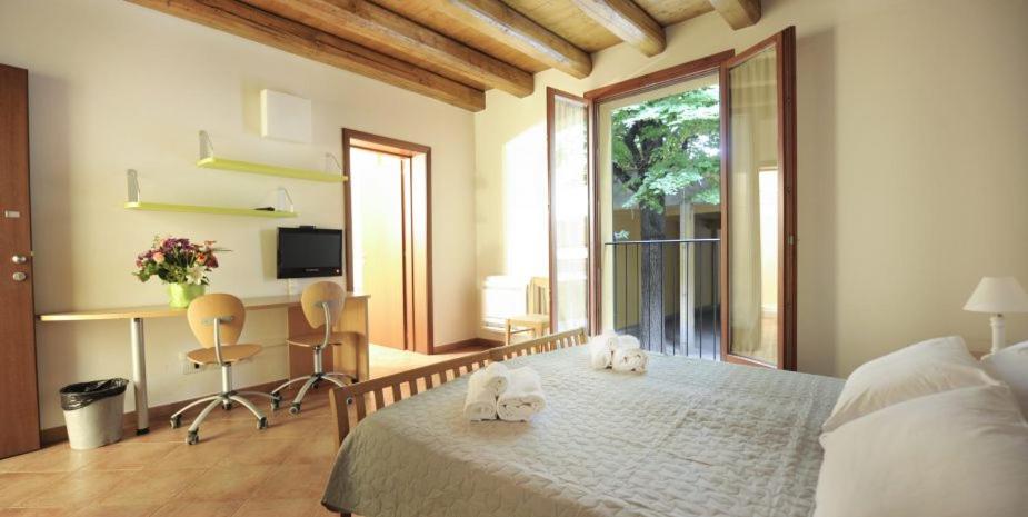 A bed or beds in a room at Residence Cavazza