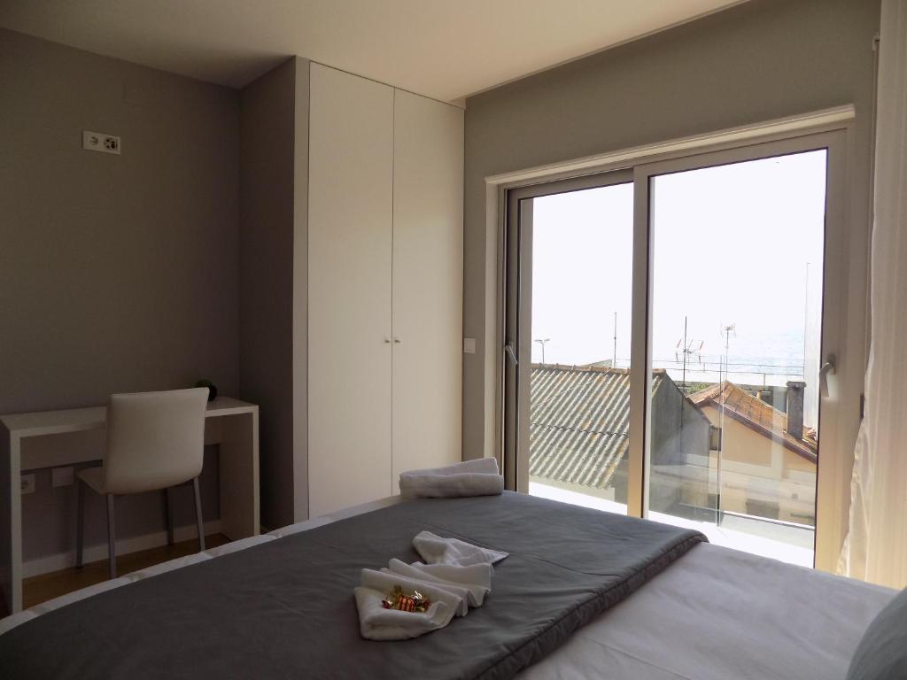 Postel nebo postele na pokoji v ubytování CMB Guesthouse