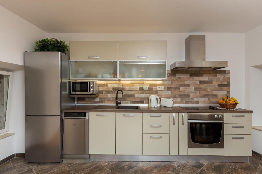 Kuchyňa alebo kuchynka v ubytovaní Apartment Maru Prestige