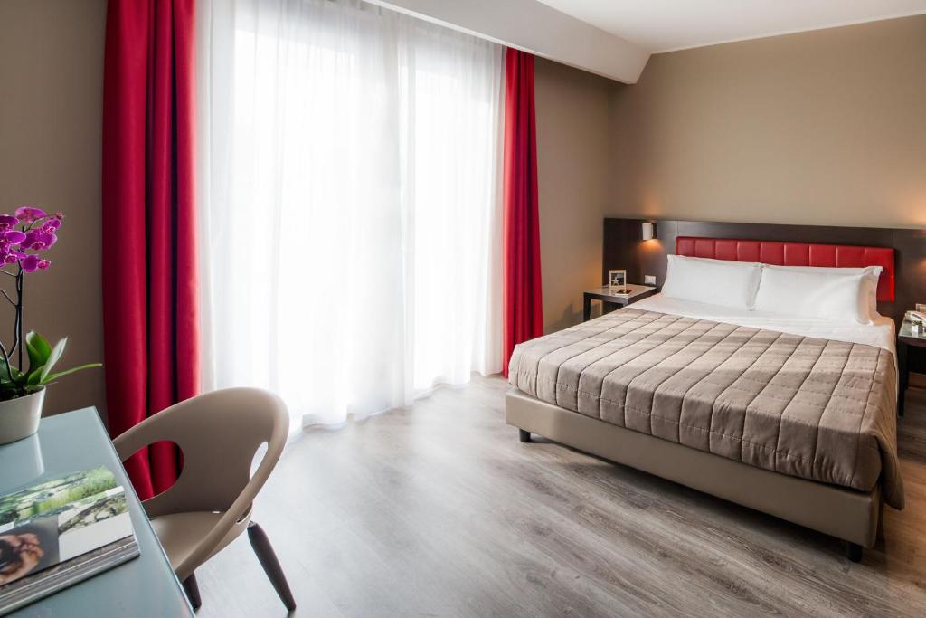 Postel nebo postele na pokoji v ubytování Hotel Da Vinci