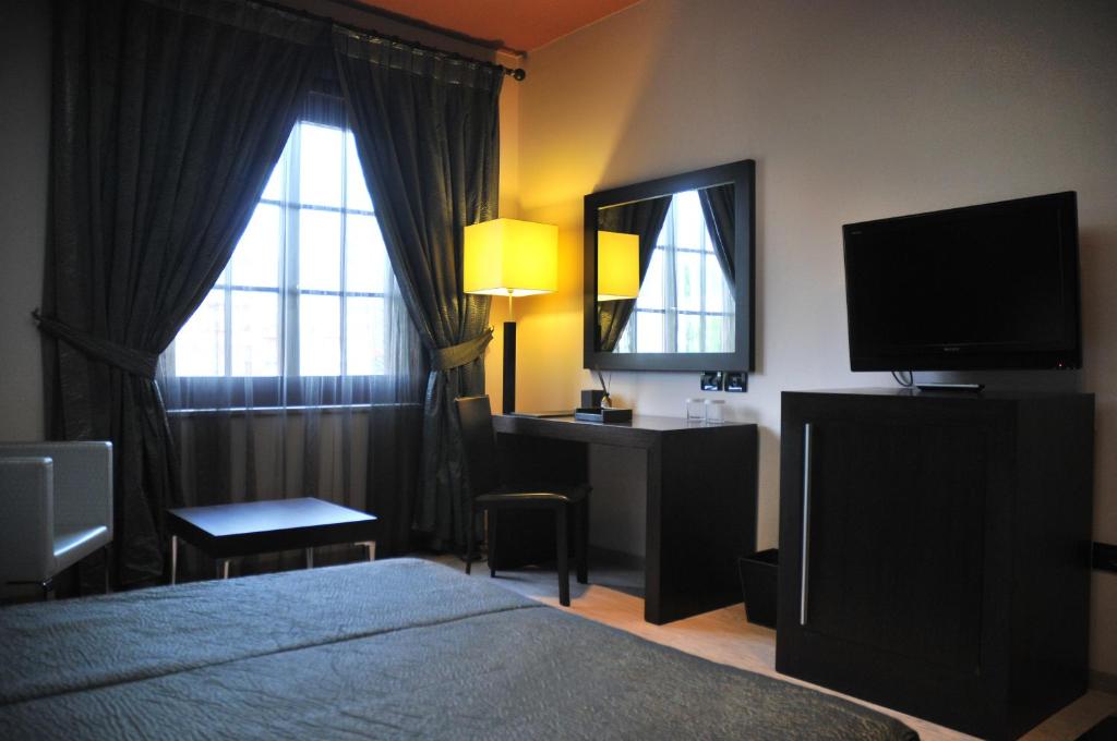 Postel nebo postele na pokoji v ubytování MonarC Hotel