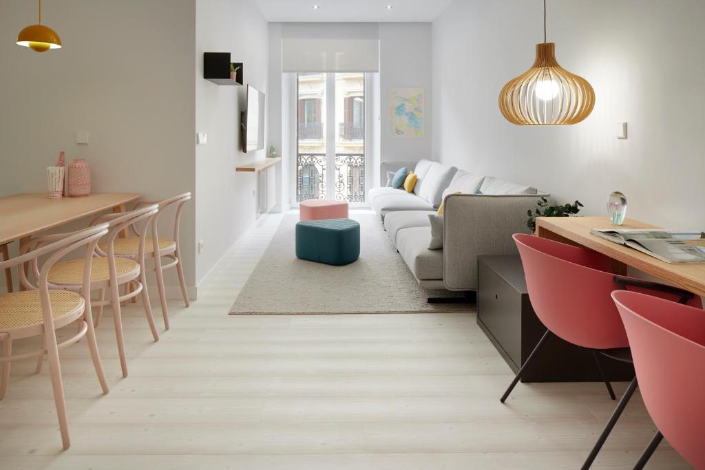 a living room with a couch and a table at Bilbao Plaza by FeelFree Rentals in San Sebastián
