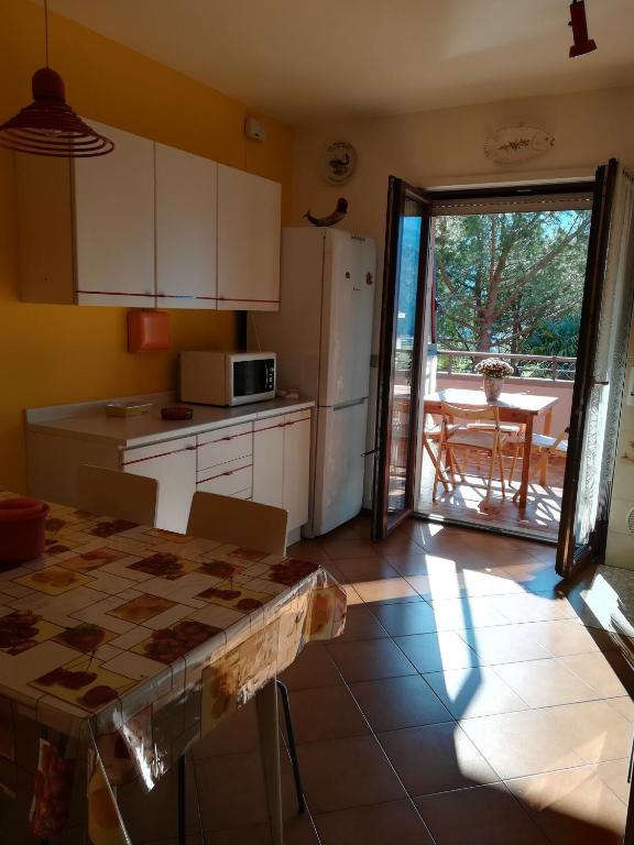 A kitchen or kitchenette at Donatella Apartment