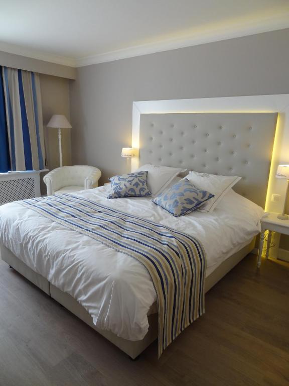 Postel nebo postele na pokoji v ubytování Ara Dune Hotel