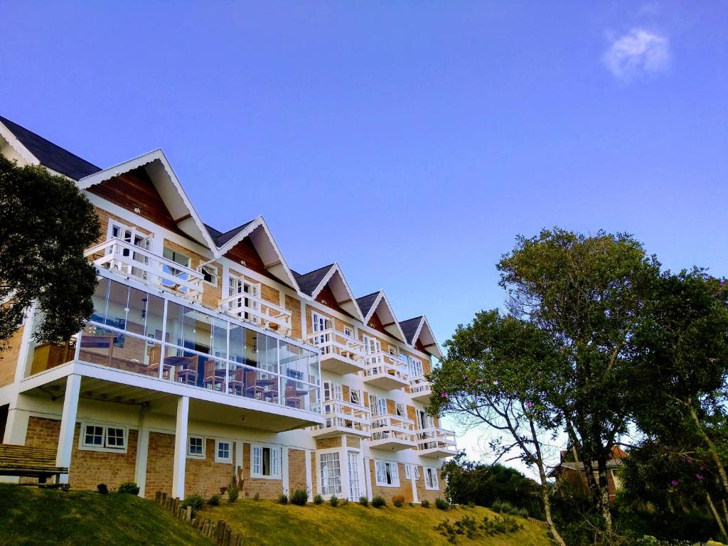 a large building on top of a hill at Pousada Miraggio in Campos do Jordão