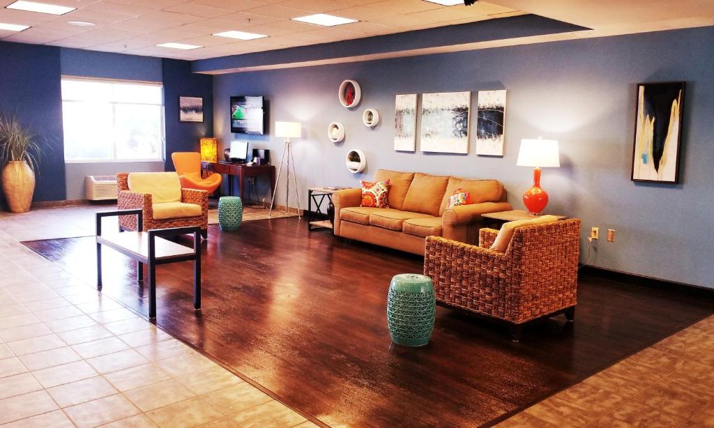 a waiting room with a couch and chairs and a table at Beach Boutique Hotel in Rehoboth Beach