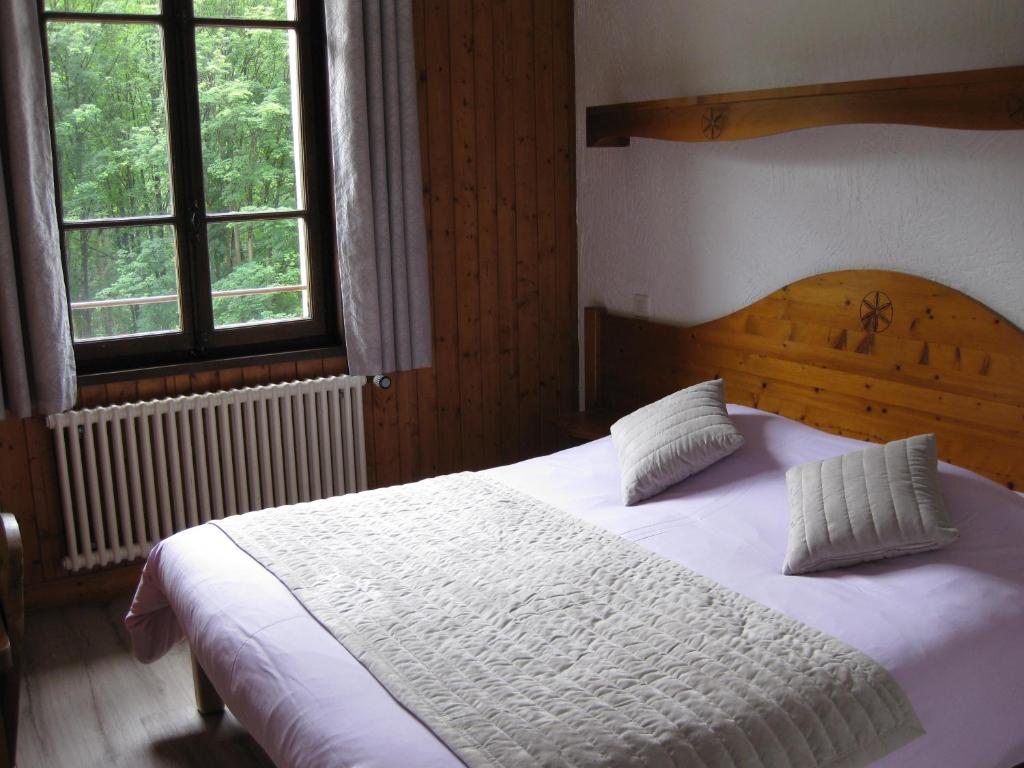 Postel nebo postele na pokoji v ubytování Hotel des Lacs