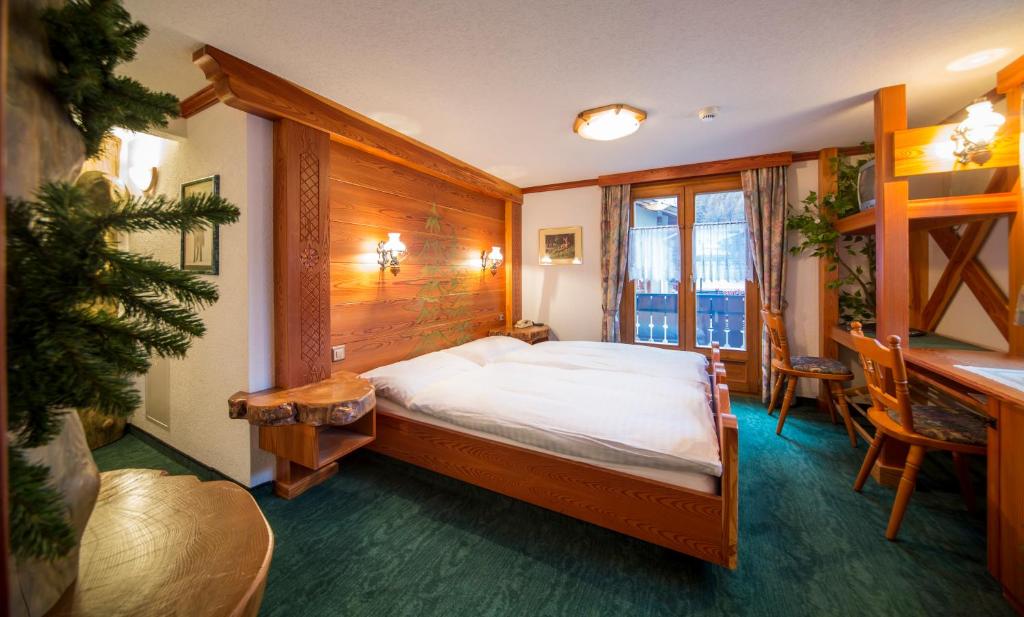 Postel nebo postele na pokoji v ubytování Hotel Olympia