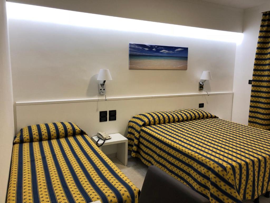 Postel nebo postele na pokoji v ubytování Hotel Bahamas