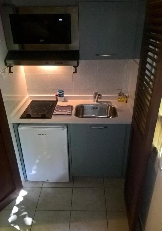 Kuchyň nebo kuchyňský kout v ubytování Caraib'Bay Hotel