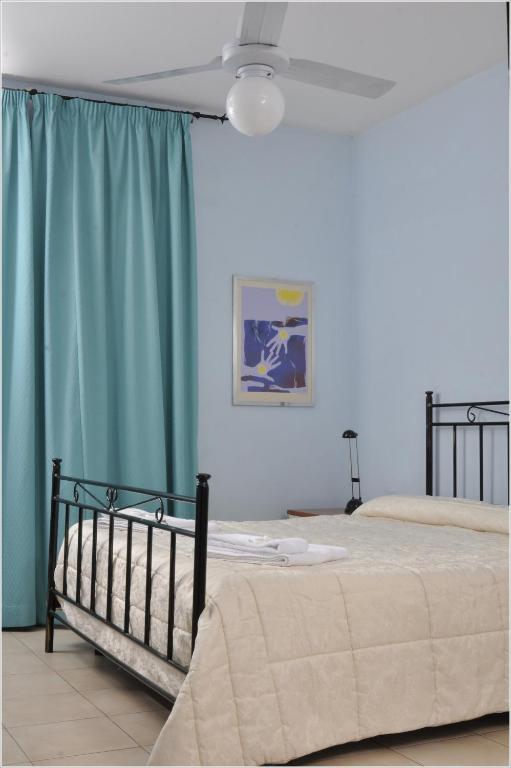 Łóżko lub łóżka w pokoju w obiekcie Gialel Guesthouse