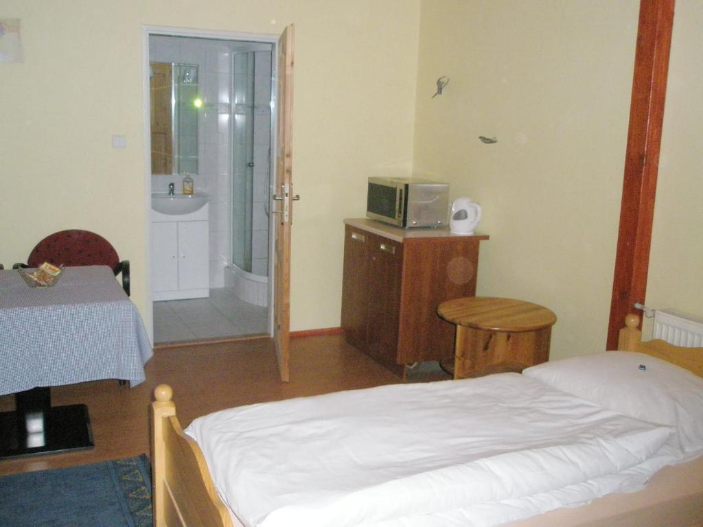 Postel nebo postele na pokoji v ubytování Pension Kozel