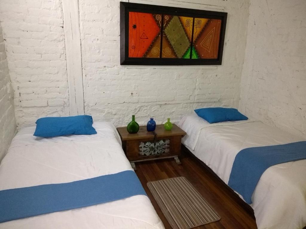 Postel nebo postele na pokoji v ubytování Lima Limon Candelaria Hostel
