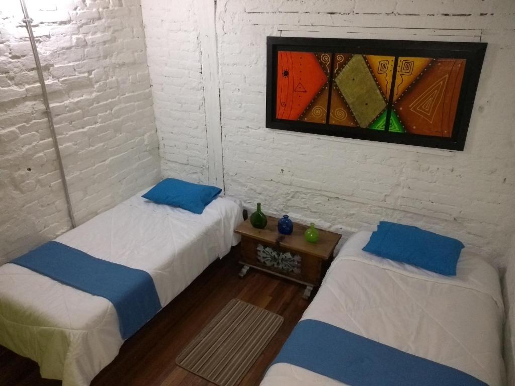Postel nebo postele na pokoji v ubytování Lima Limon Candelaria Hostel