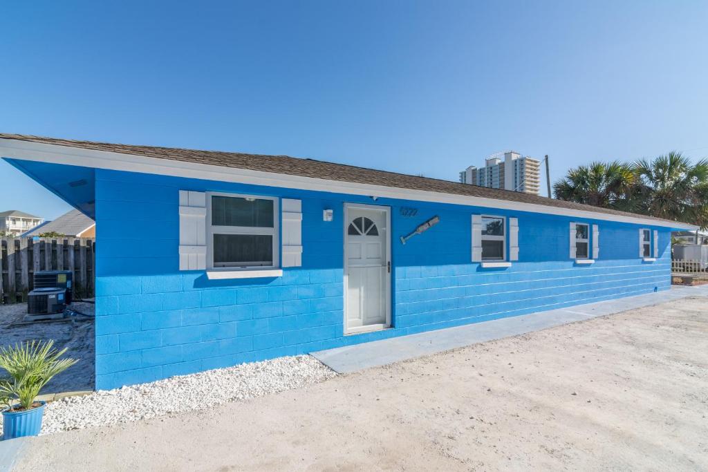 a blue tiny house with a blue exterior at Villa Serenity, Pet Friendly in Panama City Beach