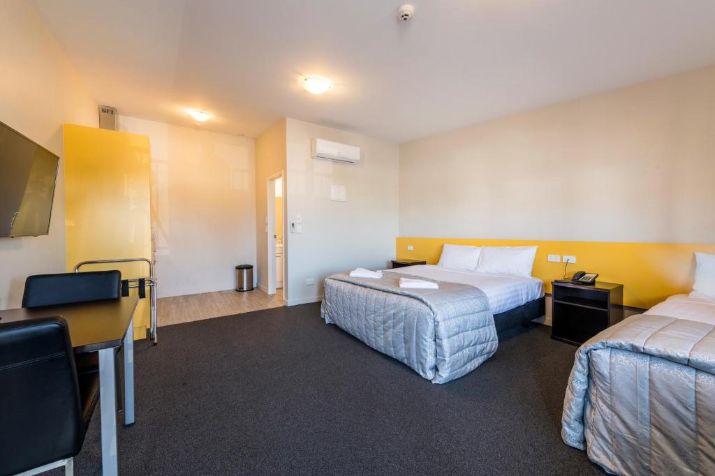 Postel nebo postele na pokoji v ubytování C-Motel