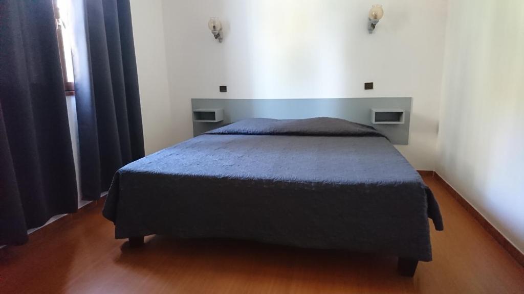 Postel nebo postele na pokoji v ubytování Ideal Camping hotel Stagnolo