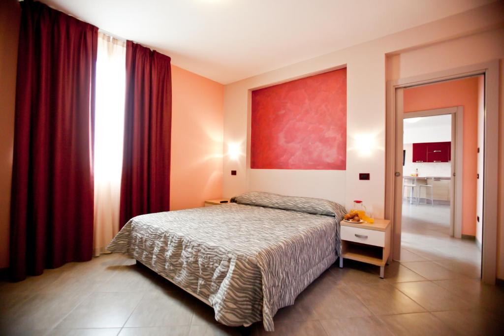 Posteľ alebo postele v izbe v ubytovaní Hotel La Cartiera