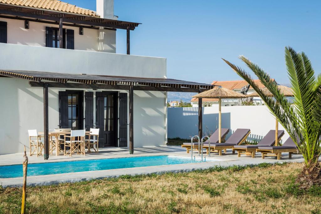 Πισίνα στο ή κοντά στο Kymata Bohemian Villas