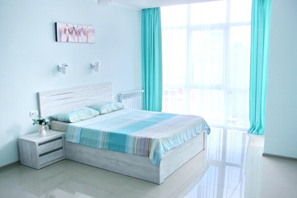 เตียงในห้องที่ Mentol Residence at Sea Resort
