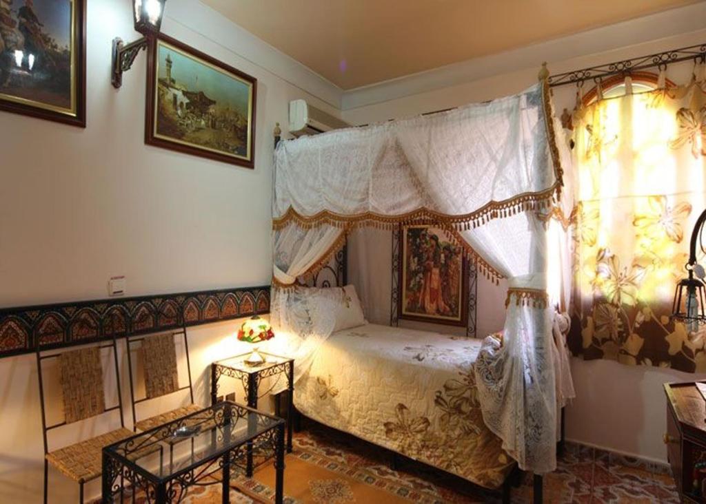 Postel nebo postele na pokoji v ubytování Moroccan House