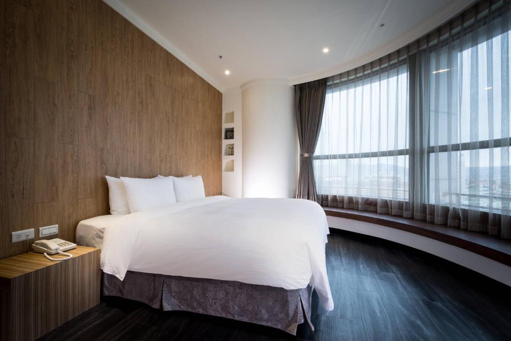 Postel nebo postele na pokoji v ubytování Merryday Hotel Banqiao