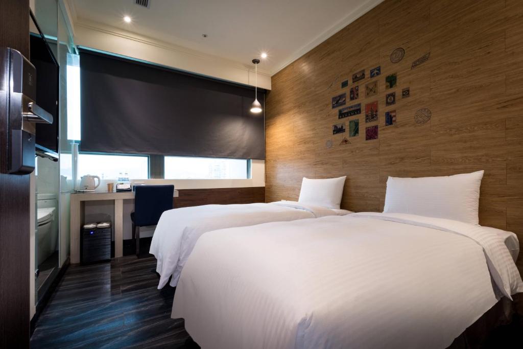 Postel nebo postele na pokoji v ubytování Merryday Hotel Banqiao