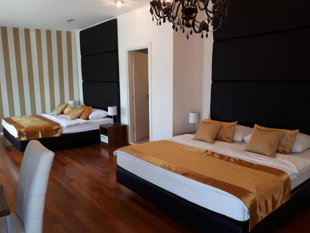 Postel nebo postele na pokoji v ubytování Perla Resort