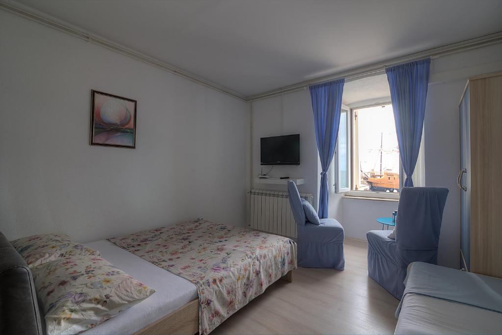 Postel nebo postele na pokoji v ubytování Apartments & Rooms Josephine