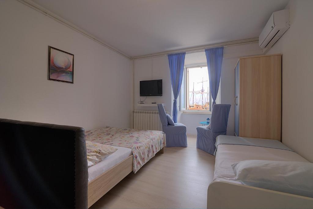 Postel nebo postele na pokoji v ubytování Apartments & Rooms Josephine