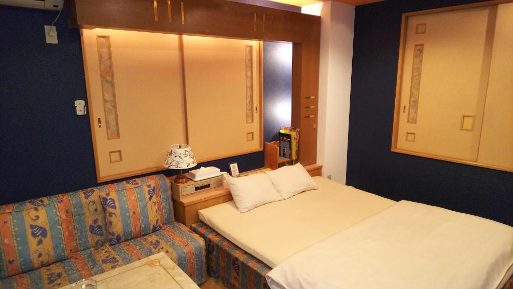Postel nebo postele na pokoji v ubytování Hotel Essor (Adult Only)