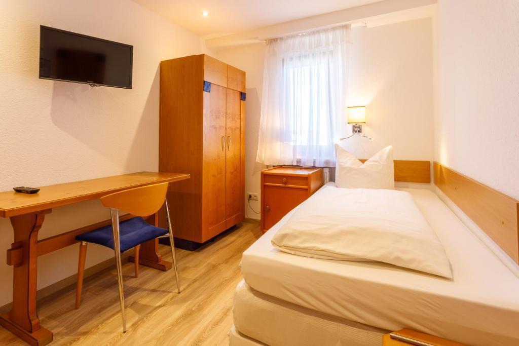 Postel nebo postele na pokoji v ubytování Hotel Spitzenpfeil