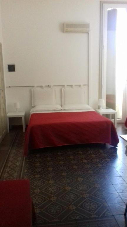 Posteľ alebo postele v izbe v ubytovaní B&B CARAVAGGIO SIRACUSA 200 Metres from Ortigia