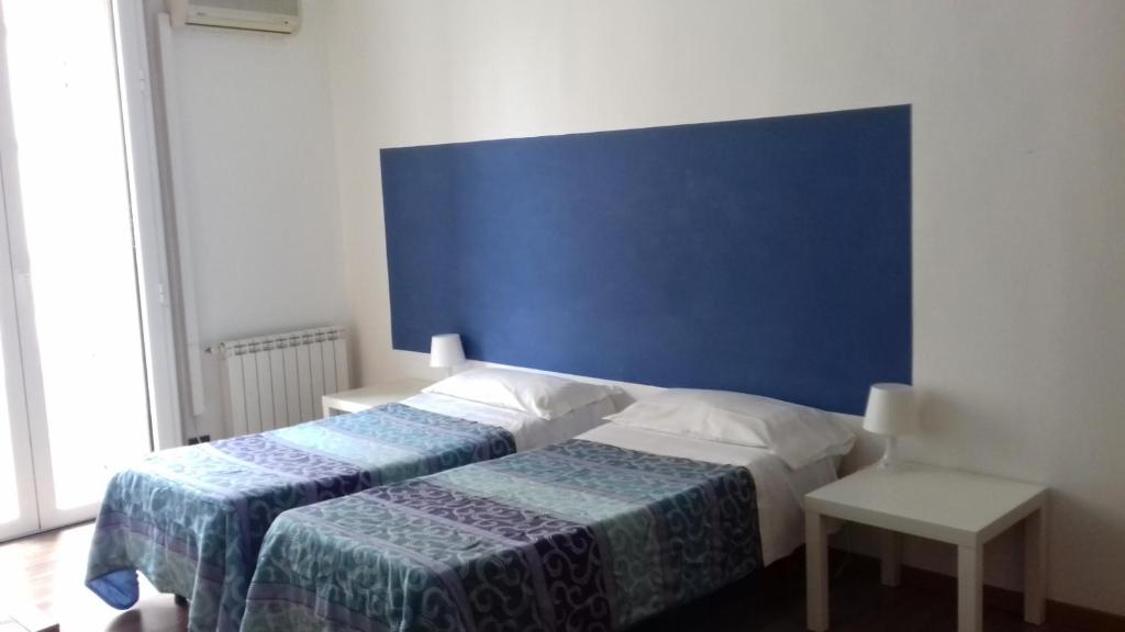 Posteľ alebo postele v izbe v ubytovaní B&B CARAVAGGIO SIRACUSA 200 Metres from Ortigia