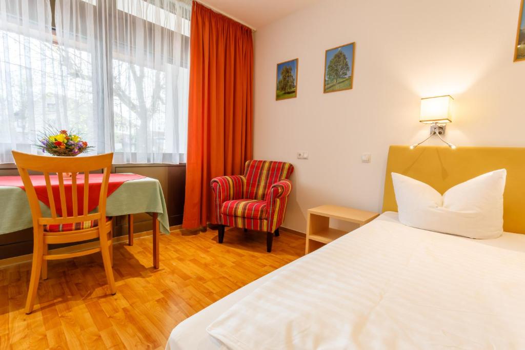 Postel nebo postele na pokoji v ubytování Hotel Spitzenpfeil
