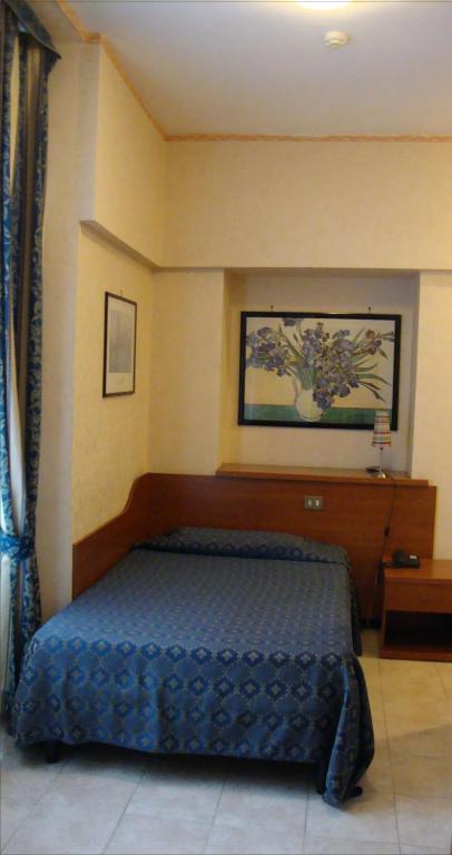 Postel nebo postele na pokoji v ubytování Hotel Orlanda