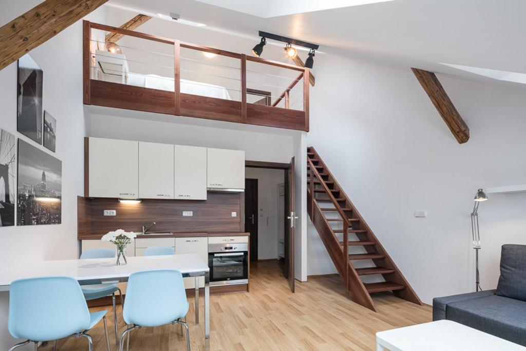 a kitchen and living room with a loft conversion at Pytloun Apartments Liberec in Liberec