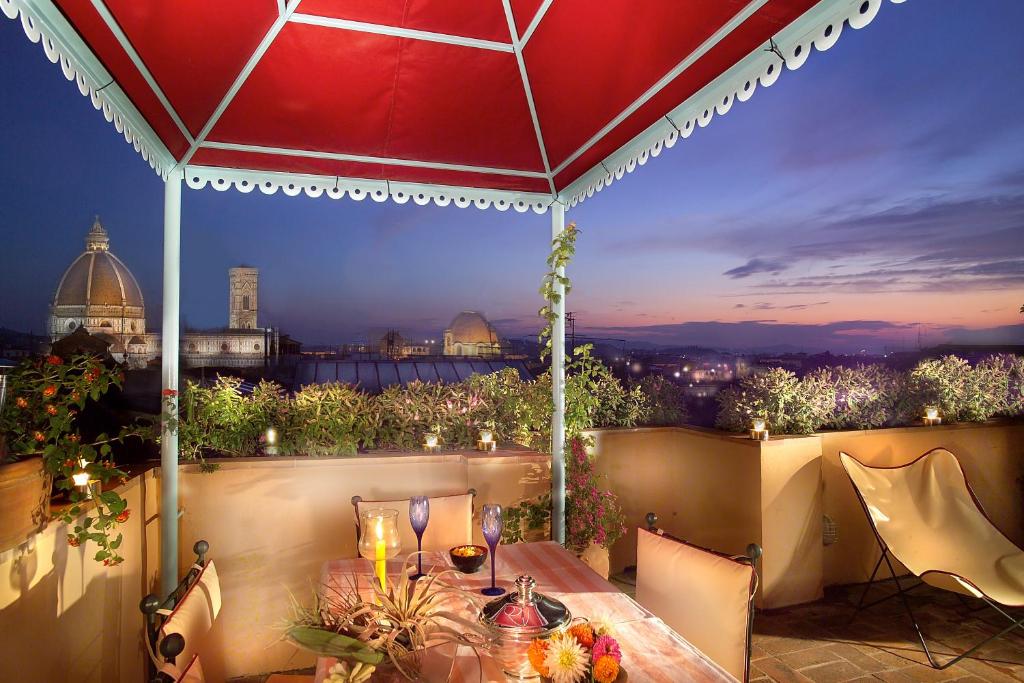 a patio with a table and a view of the city at Antica Dimora Johlea in Florence
