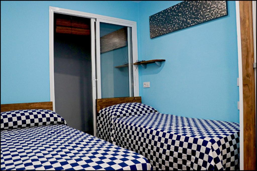 Postel nebo postele na pokoji v ubytování Apartamento Baluarte III