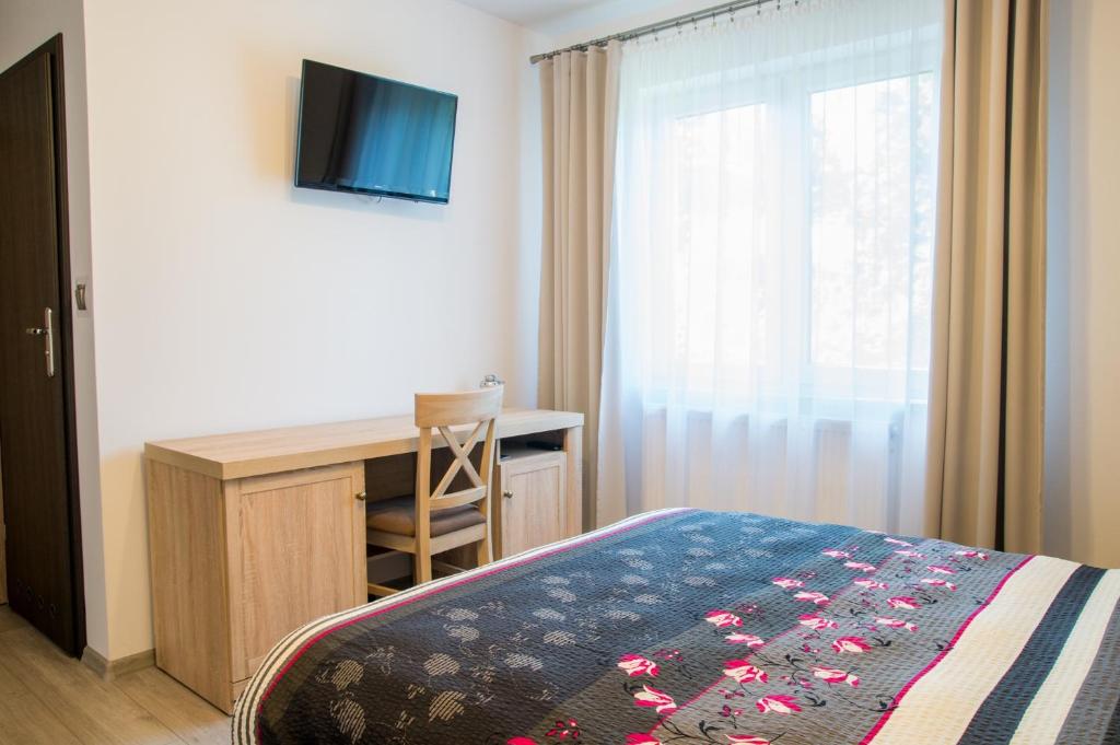 Posteľ alebo postele v izbe v ubytovaní Villa Mikołajki Popiełuszki 8