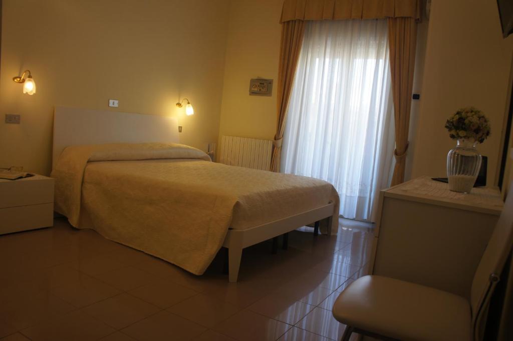 Letto o letti in una camera di Hotel Solaris