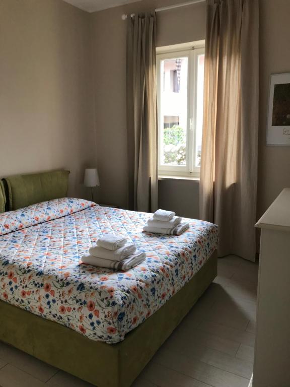 Posteľ alebo postele v izbe v ubytovaní Residenza Le Logge