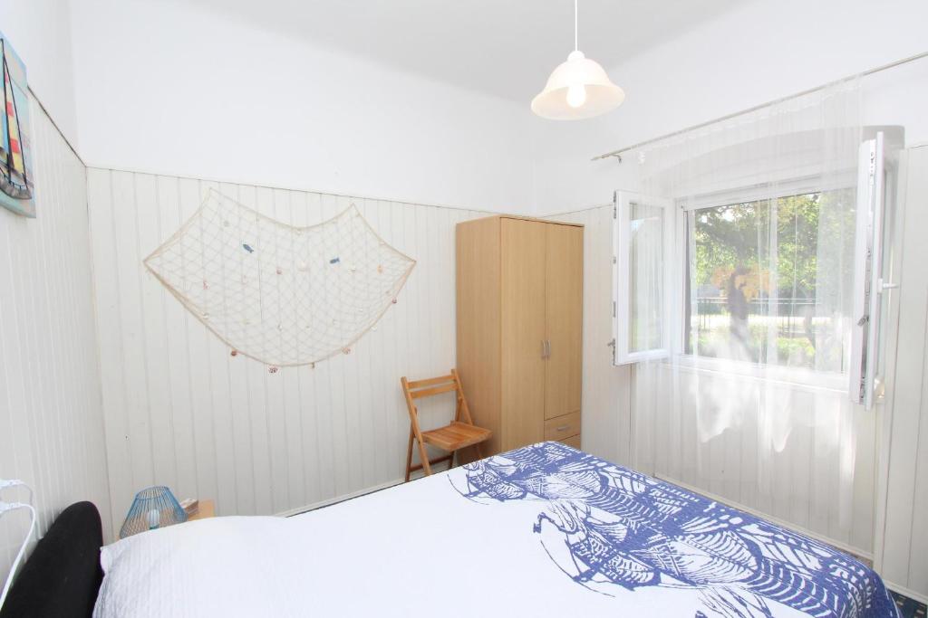 Łóżko lub łóżka w pokoju w obiekcie Apartments Rosanna