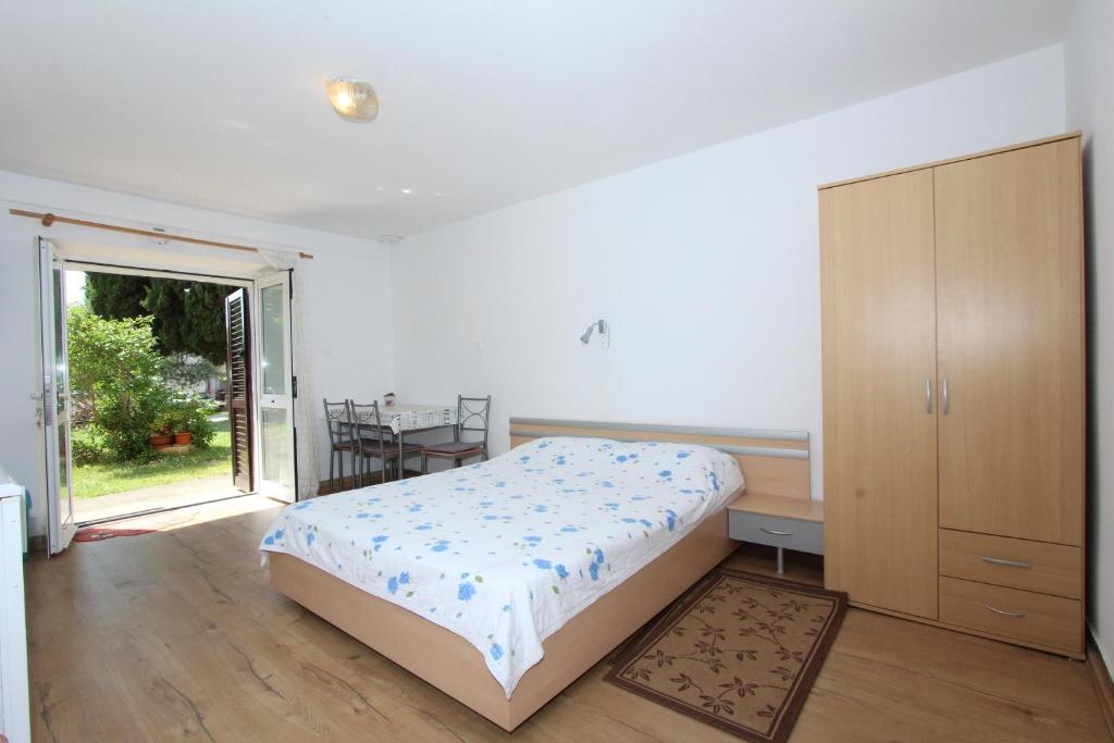 Łóżko lub łóżka w pokoju w obiekcie Apartments Rosanna